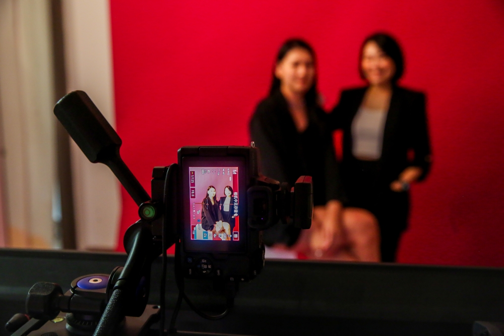 Co-founders of Fiu Studio Asaki Yok and Shallee Lee smile for the camera in Petaling Jaya July 19, 2024. — Picture by Choo Choy May
