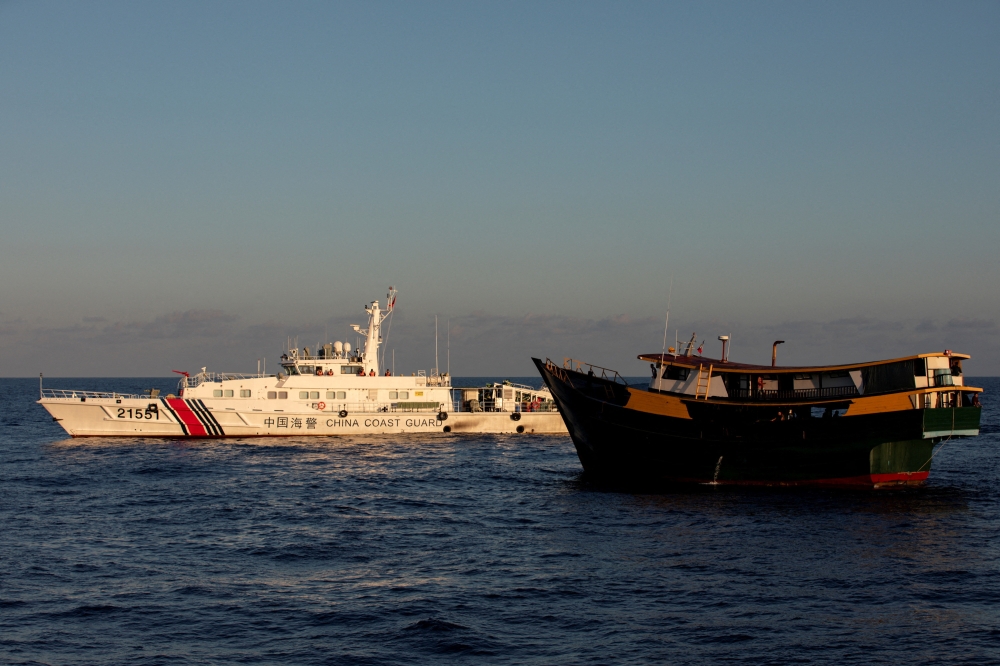 A Chinese Coast Guard vessel blocks the Philippine resupply vessel Unaizah May 4, on its way to a resupply mission at Second Thomas Shoal in the South China Sea, in this file picture dated March 5, 2024. — Reuters pic 