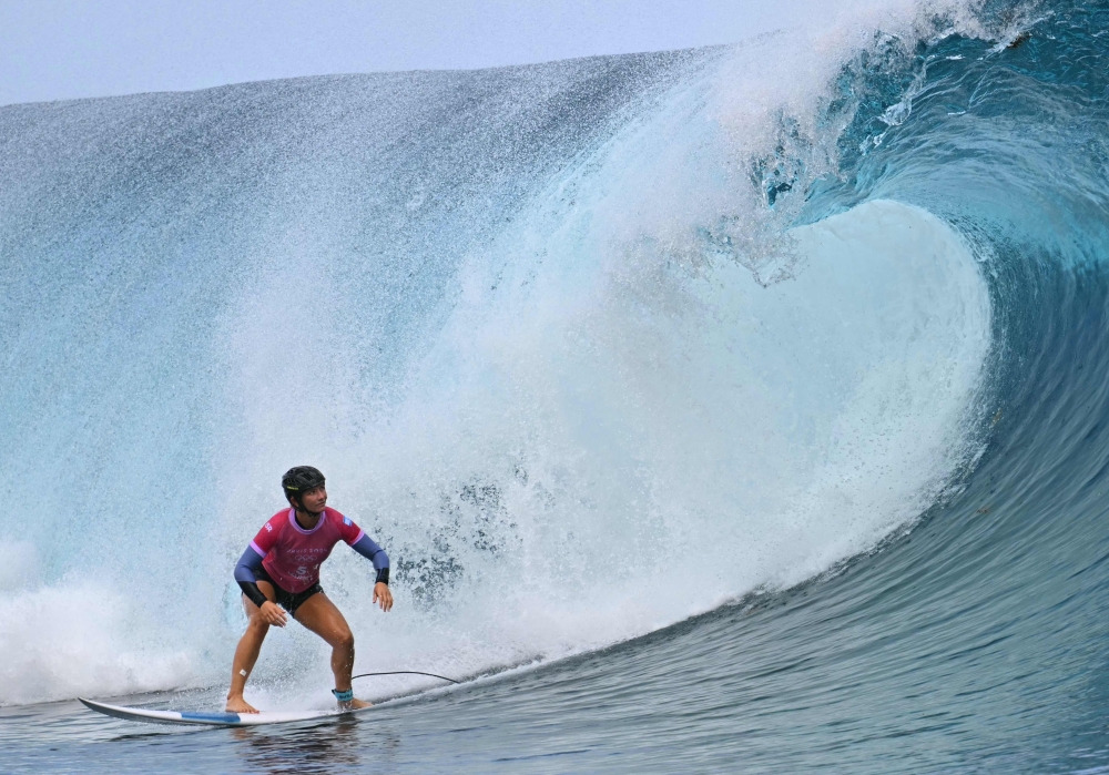 Israel’s Anat Lelior competes in the 3rd heat of the women's surfing round 1 of the Paris 2024 Olympic Games in Teahupo’o in Tahiti on July 27, 2024. Israeli athletes’ data have been hacked and posted on social media sites. — AFP