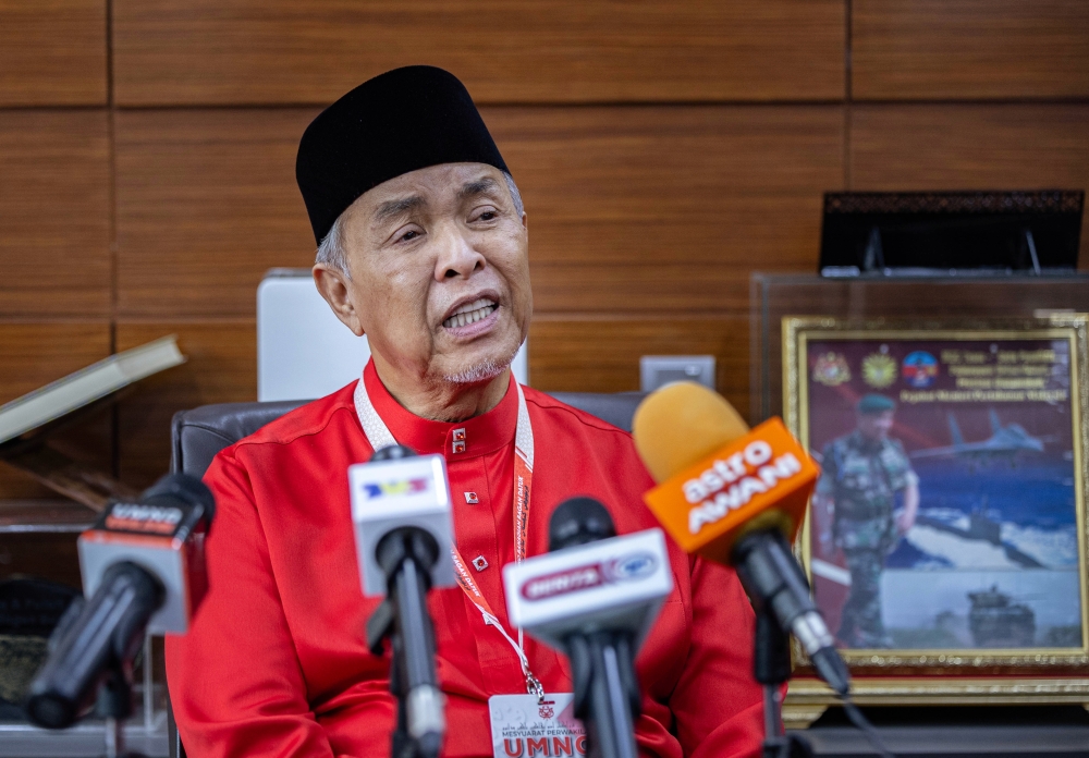 Deputy Prime Minister and Umno president Datuk Seri Ahmad Zahid Hamidi responds to media questions after attending the 2024 Bagan Datuk Umno Division Delegates Meeting in Bagan Datuk July 28, 2024. — Bernama pic