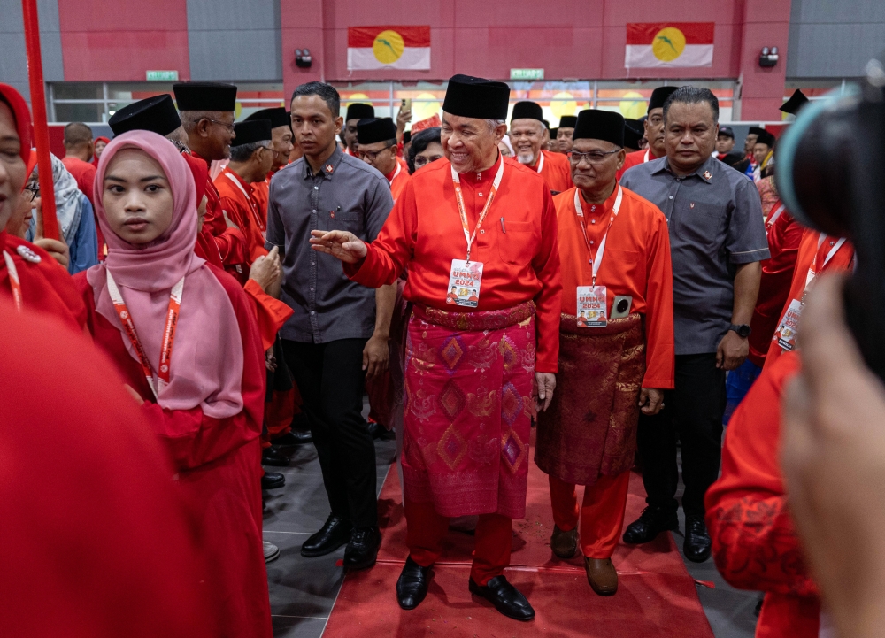 Deputy Prime Minister and Umno president Datuk Seri Ahmad Zahid Hamidi attends the 2024 Bagan Datuk Umno Divisional Delegates Meeting in Bagan Datuk July 28, 2024. — Bernama pic