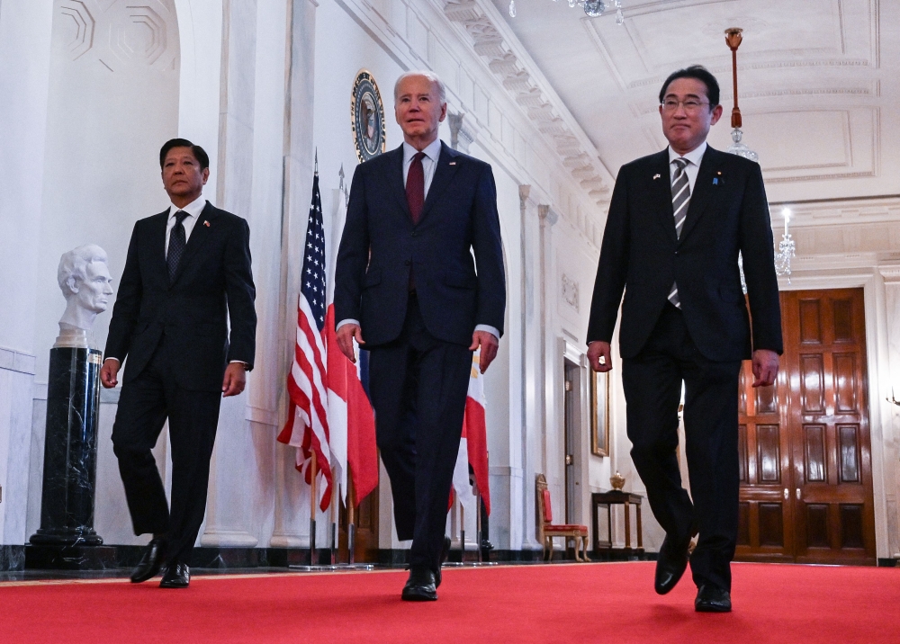 File picture of US President Joe Biden heading to a trilateral meeting with Japanese Prime Minister Fumio Kishida (right) and Filipino President Ferdinand Marcos Jr at the White House in Washington, DC, on April 11, 2024. — AFP pic 