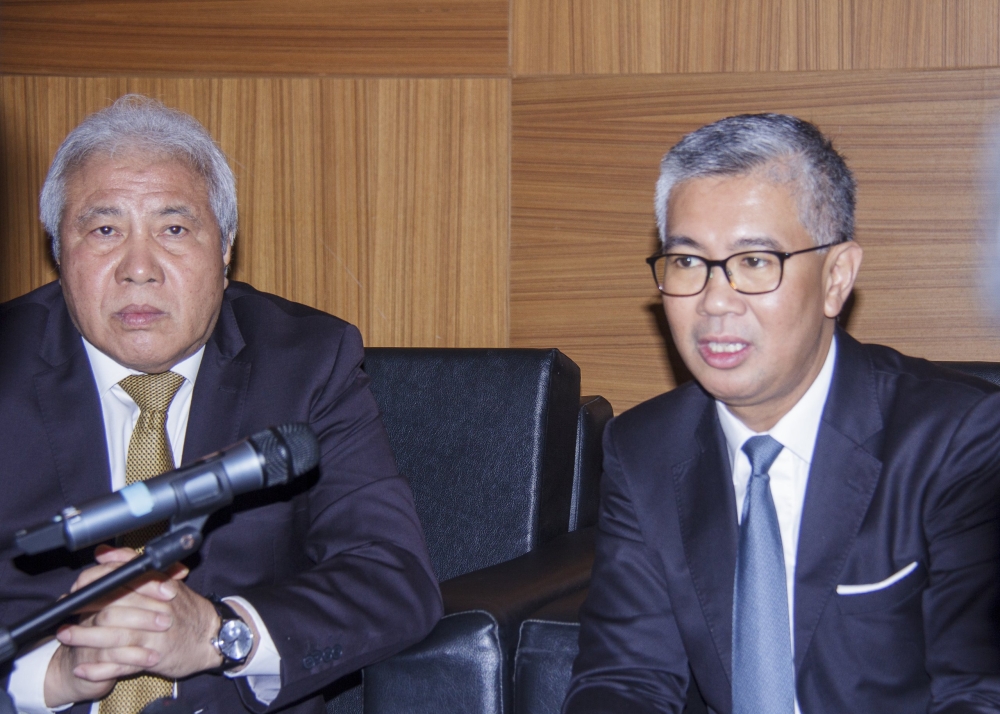 Awang Tengah (left) and Tengku Zafrul during the press conference. — Photo by Faisal Ahmad