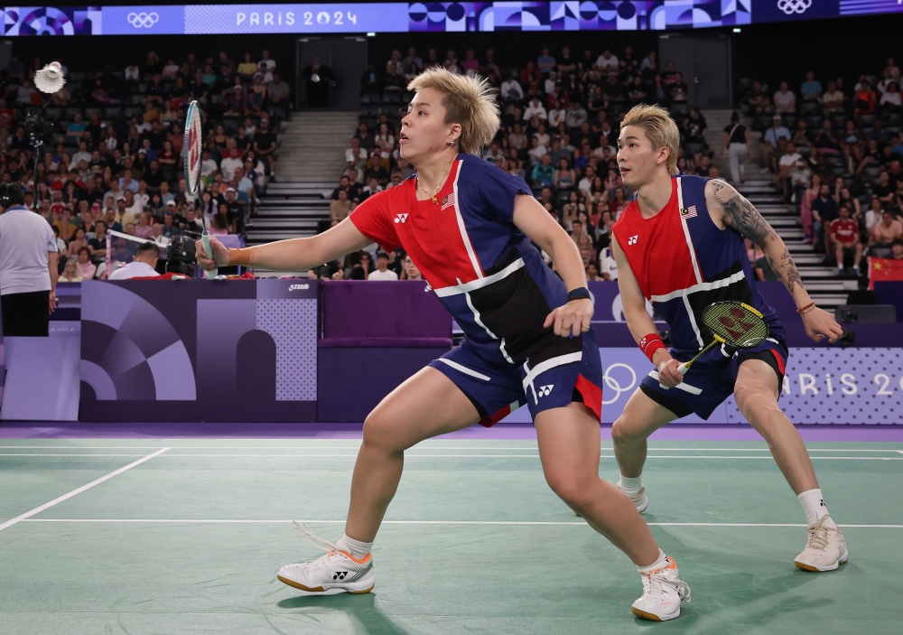 National mixed doubles pair, Chen Tang Jie and Toh Ee Wei, compete against China’s Feng Yan Zhe and Huang Dong Ping in the Group D match at the 2024 Paris Olympics July 29, 2024. — Bernama pic