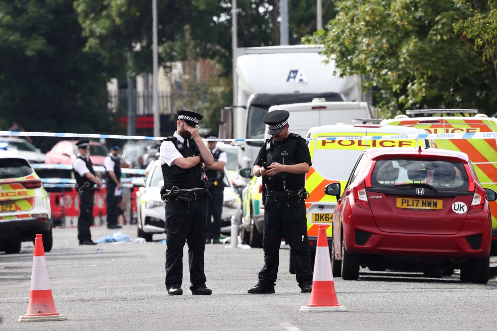 Police officers stand guard on Hart Street in Southport, northwest England, on July 29, 2024, following a knife attack. — AFP pic