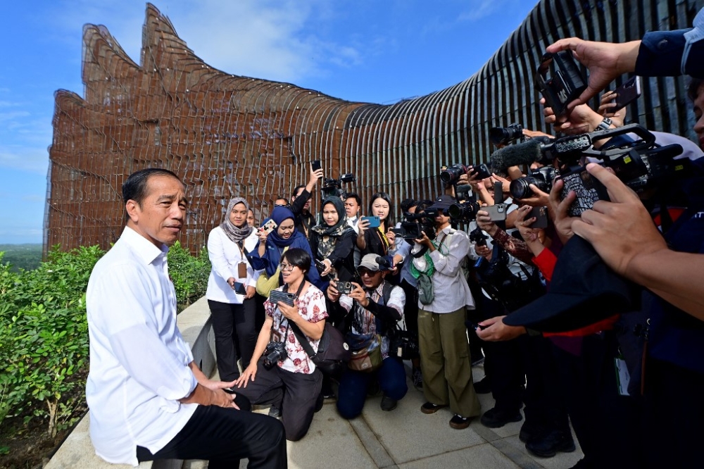 This handout picture taken and released on July 29, 2024 by Indonesia’s Presidential Palace shows Indonesia’s President Joko Widodo speaking to the media as he visits the new Presidential Palace in the future capital city of Nusantara (IKN) in Penajam Paser Utara, East Kalimantan. — AFP pic