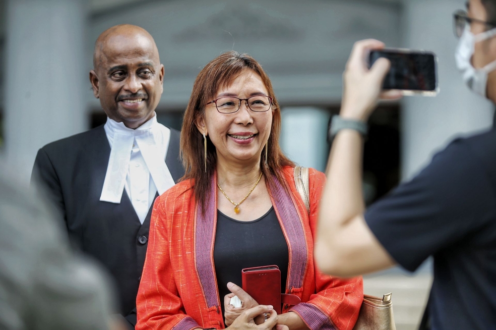 A file photograph shows Seputeh MP Teresa Kok (centre) at the Kuala Lumpur Court Complex in July 2022. — Picture by Ahmad Zamzahuri