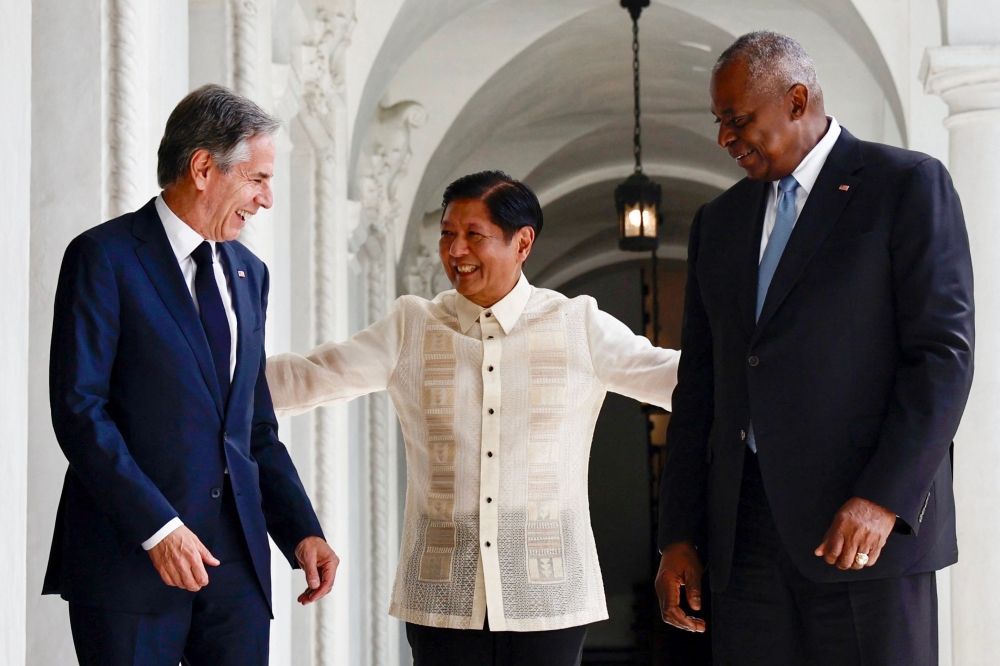 Philippines’ President Ferdinand Marcos Jr. (centre) talks to US Secretary of State Antony Blinken (left) and US Secretary of Defence Lloyd Austin at Malacanang Palace in Manila July 30, 2024. — AFP pic