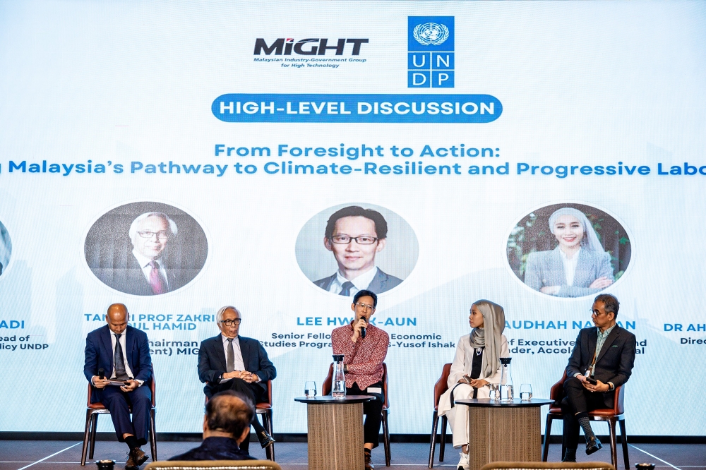 (From left) UNDP Senior Economist and Head of Sustainable Development Policy Alizan Mahadi, MIGHT’s Joint-Chairman (Government) Prof Emeritus Tan Sri Zakri Abdul Hamid, ISEAS-Yusof Ishak Institute Senior Fellow Lee Hwok-Aun, Accelerate Global Founder and CEO Raudhah Nazran and Bursa Malaysia Group Sustainability Director Ahmad Hezri Adnan are seen during the panel discussion on UNDP Socioeconomic Futures of Malaysia’s Climate and Demographic High-Level Dialogue in Kuala Lumpur July 30, 2024. — Picture by Firdaus Latif