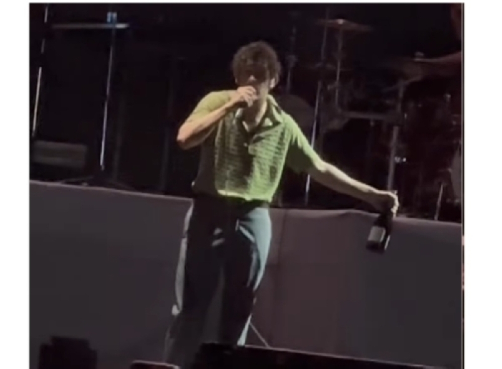 The 1975's performance was cut short after frontman Matt Healy launched into an expletive-ridden tirade against Malaysia’s anti-LGBT laws and onstage kiss with bassist Ross MacDonald. — Screen capture of video shared on social media/Amie Stan