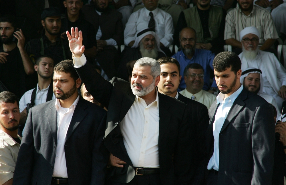 Then the Palestinian prime minister, Ismail Haniyeh waves to Hamas supporters during a rally in Gaza City, 6 October 2006. — AFP pic