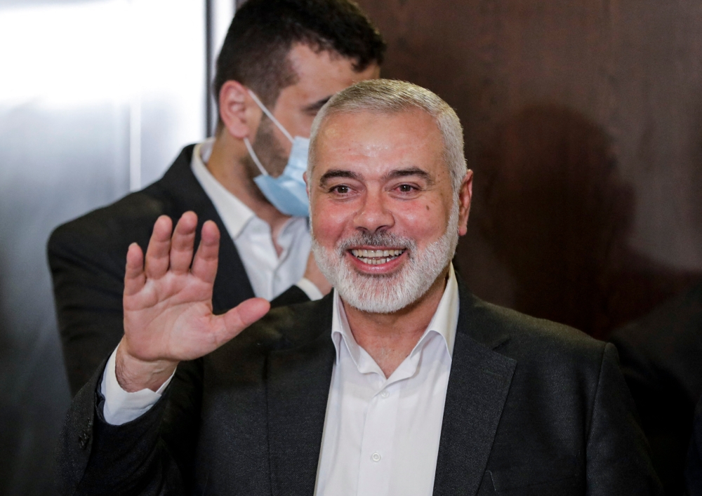 Hamas chief Ismail Haniyeh waves upon arriving for a meeting with representatives of other Palestinian factions at the Palestinian embassy in Lebanon's capital Beirut on September 3, 2020. — AFP pic
