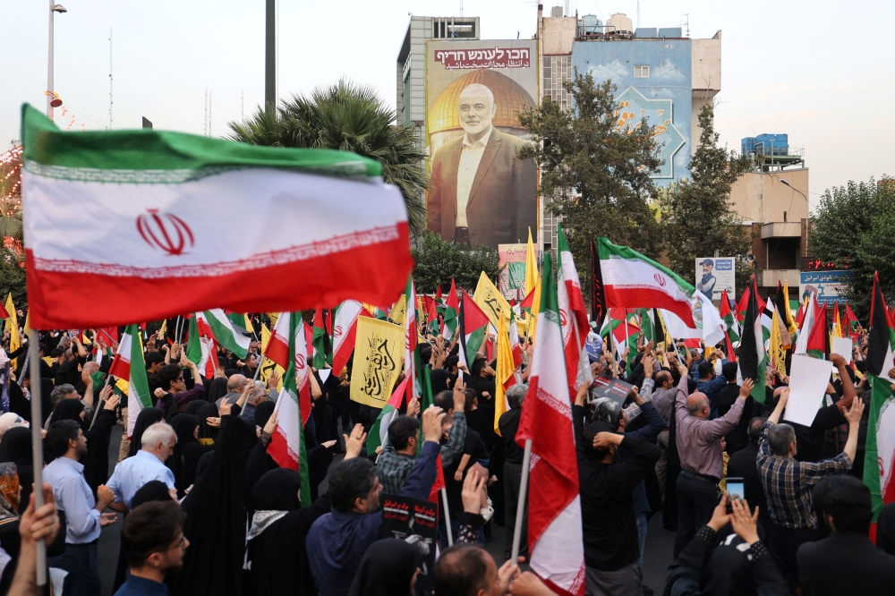 People attend an anti-Israel gathering following the killing of Palestinian group Hamas’ leader Ismail Haniyeh, amid the ongoing conflict between Israel and Hamas, in Tehran, Iran July 31, 2024. — Majid Asgaripour/Wana (West Asia News Agency) handout pic via Reuters 