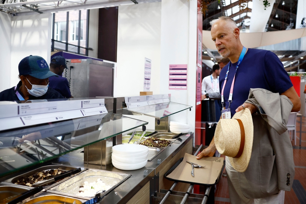 Hungary Minister of Defence and Sport Kristof Szalay-Bobrovniczky at the Olympic Village food hall. — Reuters pic