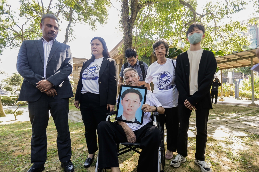 The family of the late Teoh Beng Hock and their lawyer Ramkarpal Singh (far left) speak to the press after meeting Prime Minister Datuk Seri Anwar Ibrahim at Perdana Putra in Putrajaya on August 1, 2024. — Picture by Sayuti Zainudin