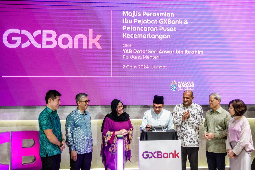 Prime Minister Datuk Seri Anwar Ibrahim officiates the launch of the GX Bank Headquarters and GX Bank Centre of Excellence in Petaling Jaya August 2, 2024. GX Bank chairman Datuk Zaiton Mohd Hassan is on his right. — Picture by Firdaus Latif