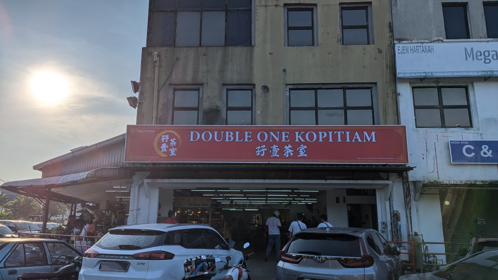 Double One Kopitiam stands at the corner of the street, where Restoran Tropikiri used to be. — Picture by Ethan Lau