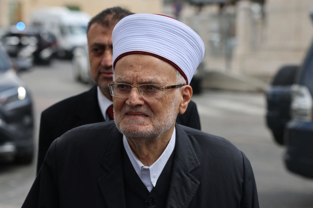 Sheikh Ekrima Sabri, the former grand mufti of Jerusalem and Imam of the Aqsa mosque, arriving for questioning over one of his sermons at the Israeli intelligence service office in Jerusalem in this file picture taken on May 8, 2023. The 85-years-old was detained on suspicion of inciting ‘terrorism’ after he mourned slain Hamas leader Ismail Haniyeh at Jerusalem's Al-Aqsa Mosque, his lawyer told AFP yesterday. — AFP pic