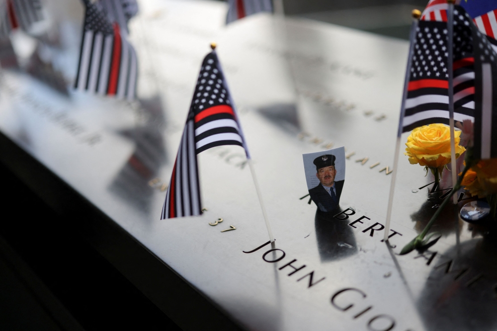 A picture is placed on the National September 11 Memorial & Museum, on the day of the 22nd anniversary of the September 11, 2001 attacks on the World Trade Centre at the National September 11 Memorial & Museum, in New York September 11, 2023. — Reuters pic