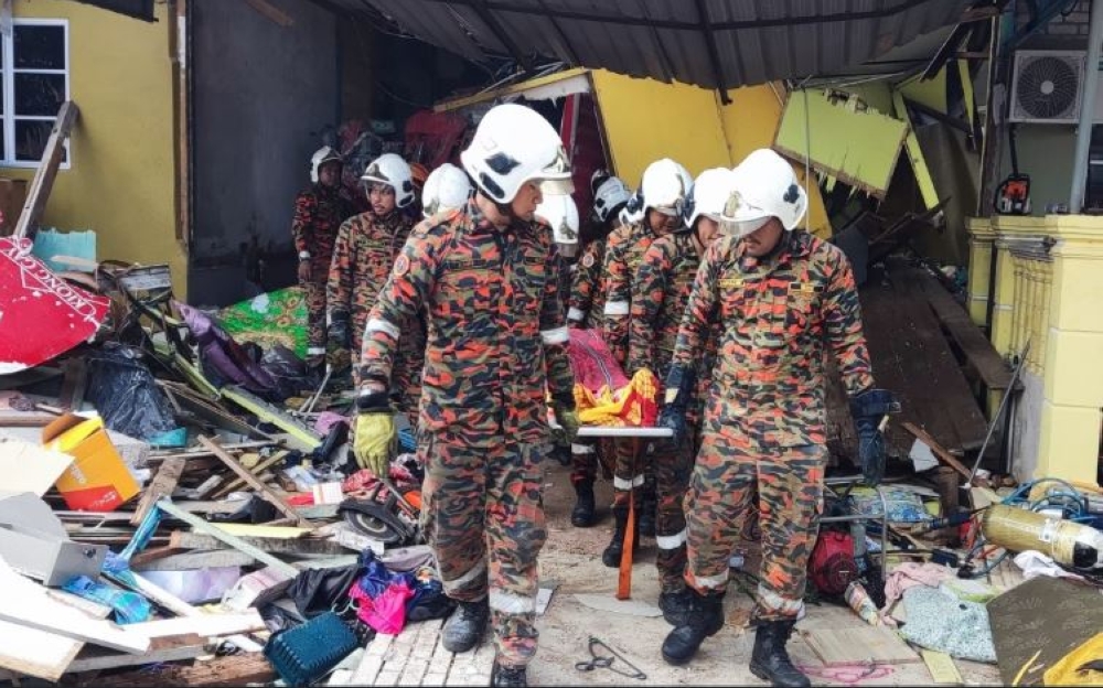 The accident occurred around 4.15am when the 40-year-old lorry driver lost control while cornering. — Picture courtesy of Fire and Rescue Department