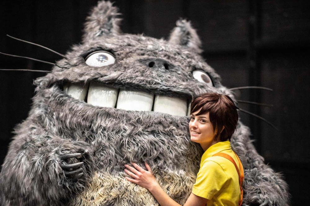 Sweden’s Henrik Pilerud, inside the Totoro costume, and his team member Victoria Christensen pose during an interview with AFP ahead of a rehearsal before the world cosplay championship 2024 during the World Cosplay Summit in Nagoya August 3, 2024. — AFP pic