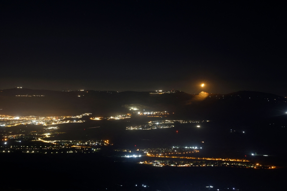 Flares of the Israeli army light up the sky of the area bordering Lebanon on August 3, 2024, amid ongoing cross-border clashes between Israeli troops and Lebanon's Hezbollah fighters. — AFP pic