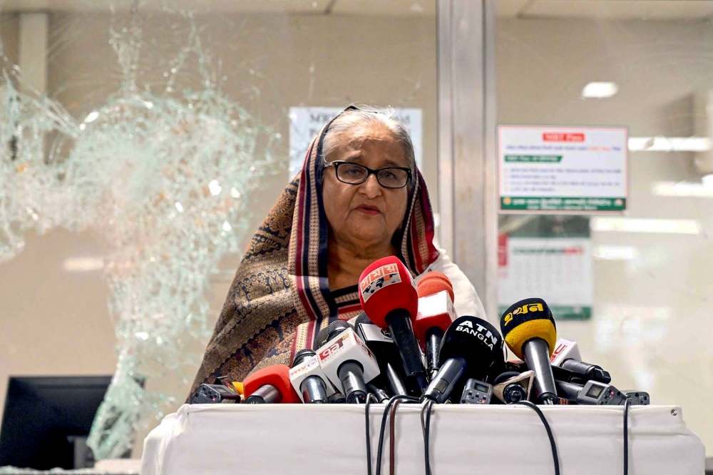 In this handout photograph taken and released on July 25, 2024 by Bangladesh Prime Minister's Office, Prime Minister Sheikh Hasina addresses the media at a vandalised metro station in Mirpur, after the anti-quota protests. — Bangladesh Prime Minister’s Office/AFP pic 