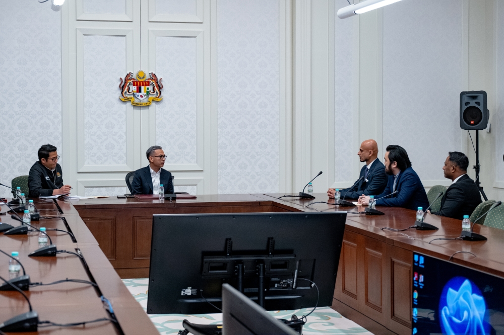 Communications Minister Fahmi Fadzil and Malaysian Communications and Multimedia Commission (MCMC) chairman Salim Fateh Din met with Meta representatives today — Sadiq Asyraf/Prime Minister’s Office pic