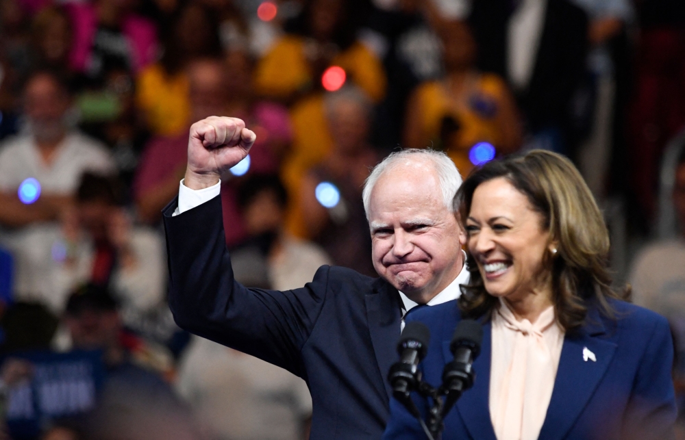 US Vice President and 2024 Democratic presidential candidate Kamala Harris speaks alongside her running mate Minnesota governor Tim Walz at Temple University's Liacouras Centre in Philadelphia, Pennsylvania, August 6, 2024, on the first day of their ‘Battleground State Tour. — AFP pic