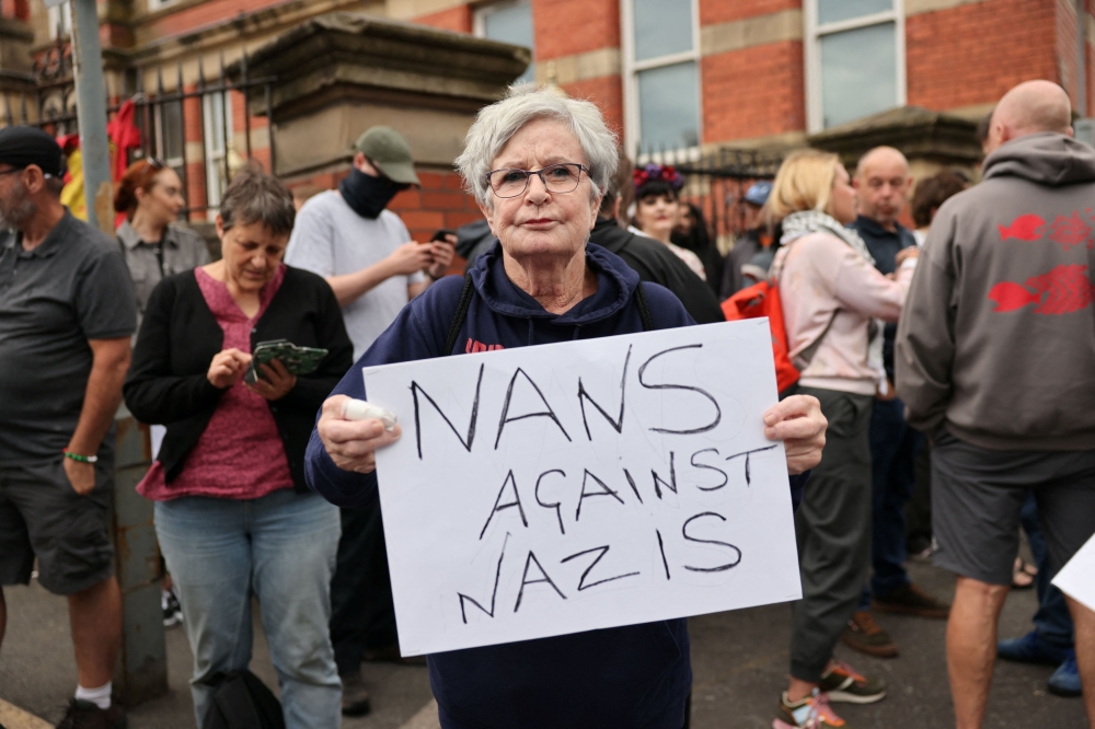 People take part in a protest outside a mosque in Liverpool August 2, 2024. — Reuters pic