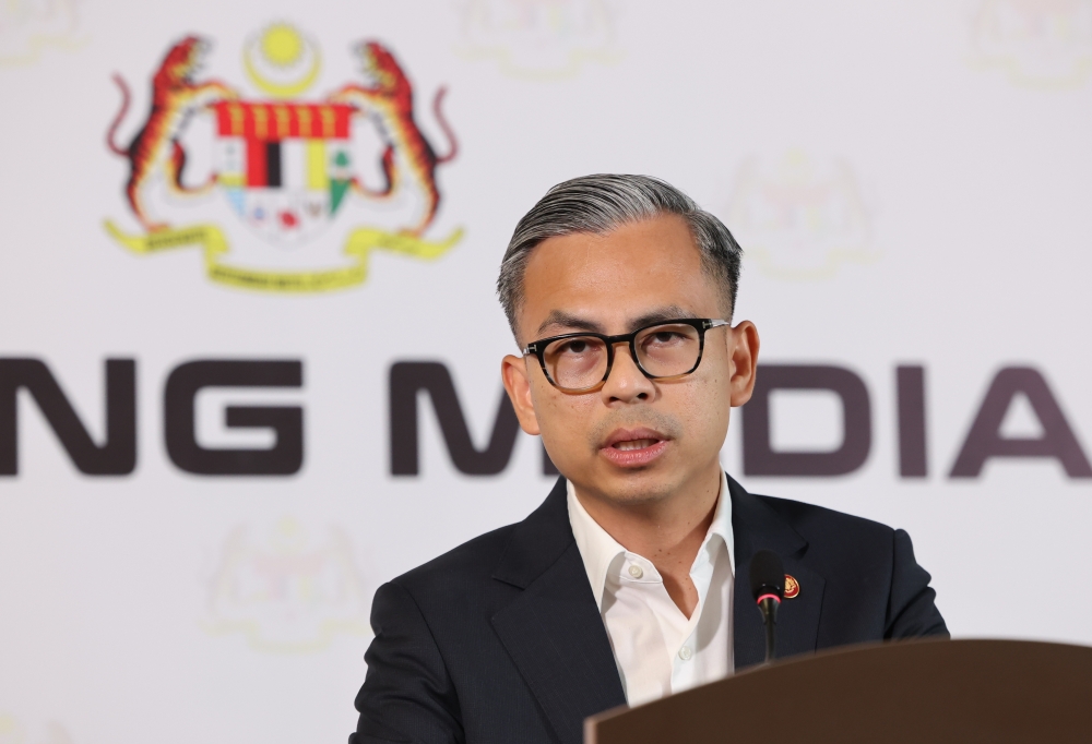 Communications Minister Fahmi Fadzil said the ministry respects the media’s right to protect information about whistleblowers or those who give information, but existing laws still apply. — Bernama pic