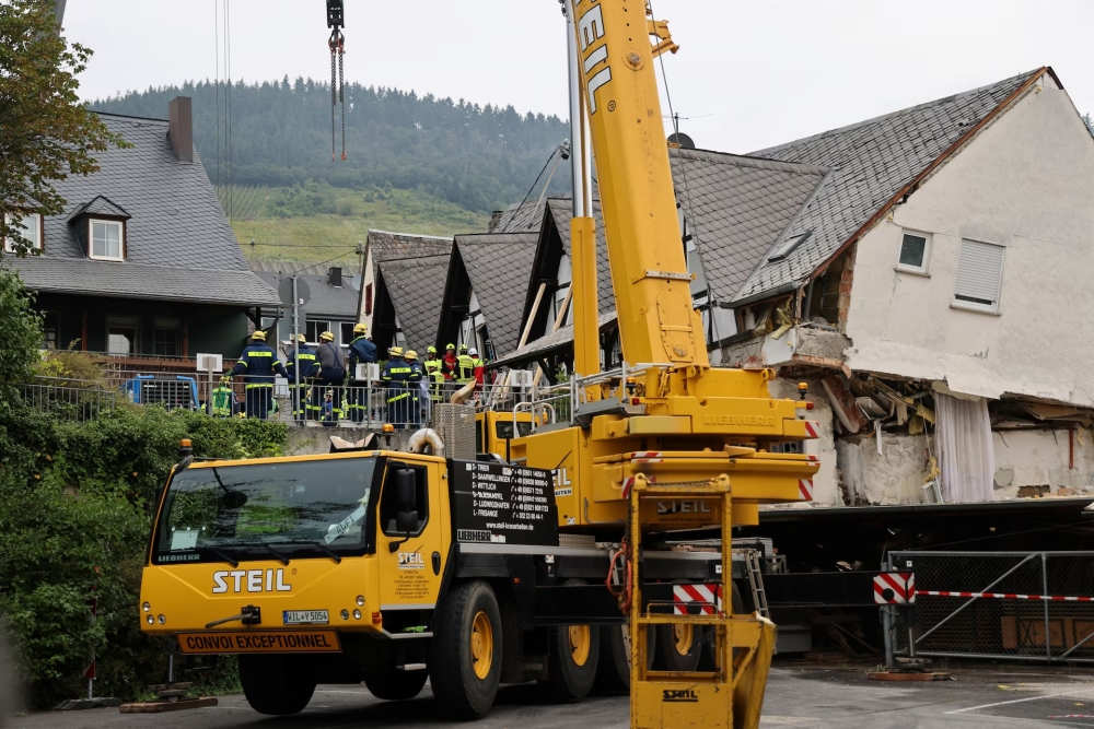 A crane is set up after a hotel partially collapsed overnight near the banks of Germany’s river Moselle in Kroev August 7, 2024. — Reuters pic