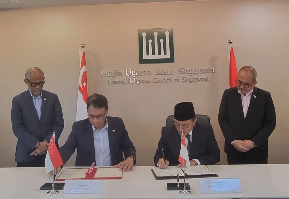 Indonesian and Singaporean officials attend the signing ceremony at Indonesia’s Embassy in Singapore on August 8, 2024. — Picture from Facebook/Indonesian Embassy Singapore