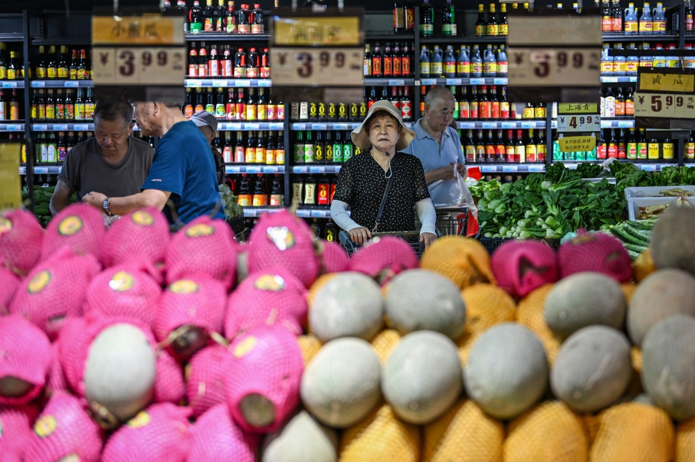Chinese consumer inflation rose more than expected in July to hit a five-month high, data showed today, providing some much-needed positive news on the world’s number-two economy. — AFP pic