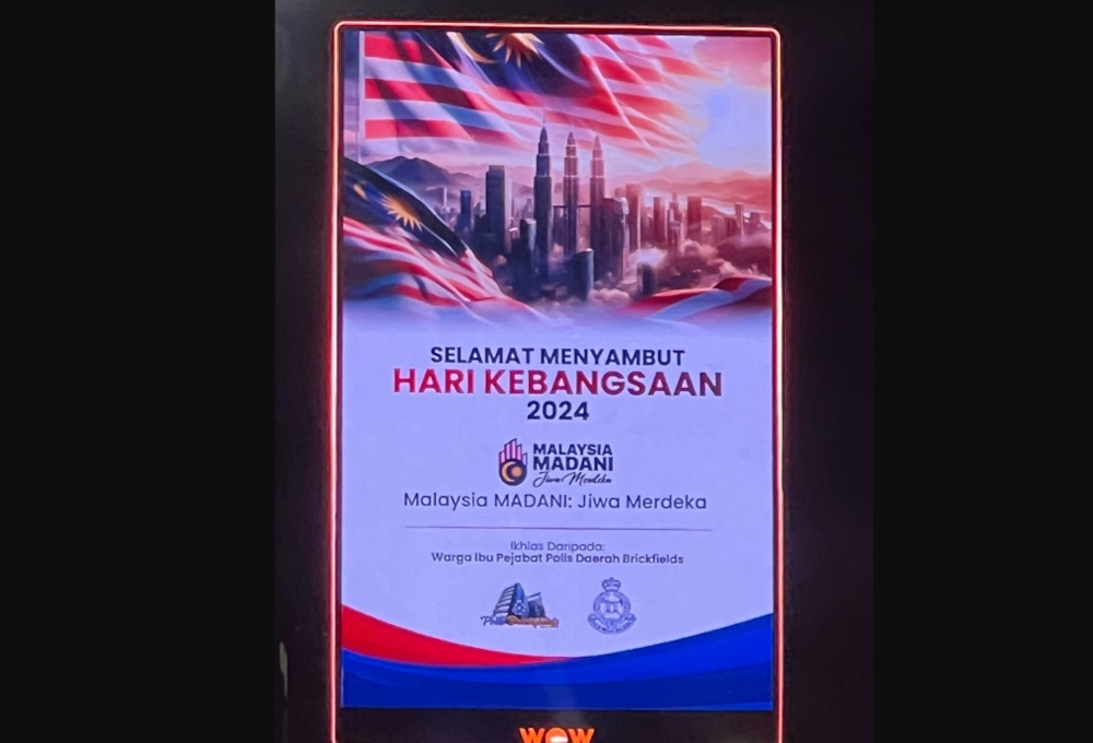 An advertising agency has issued an apology after an AI-generated digital billboard in Desa Sri Hartamas in Kuala Lumpur mistakenly depicted the Petronas Twin Towers with three towers instead of two. — Picture from social media 