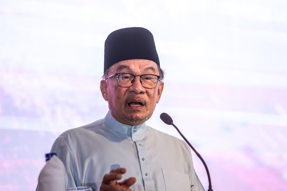 Prime Minister Datuk Seri Anwar Ibrahim speaks at the Leadership Discourse Programme Leading and Implementing MADANI Ideas at Hotel Premiera in Kuala Lumpur on August 9, 2024. — Picture by Firdaus Latif