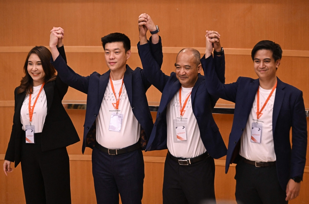 Natthaphong Ruengpanyawut (2nd L), leader of the relaunched Thai opposition party 