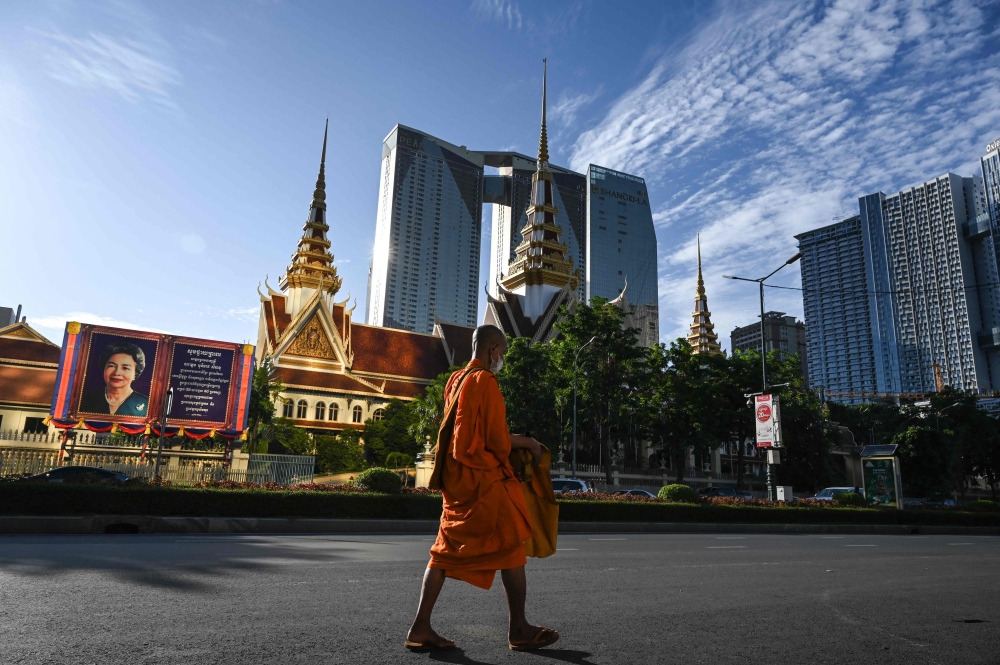 The public is being asked to stop donating unhealthy food and drinks to monks. — AFP pic