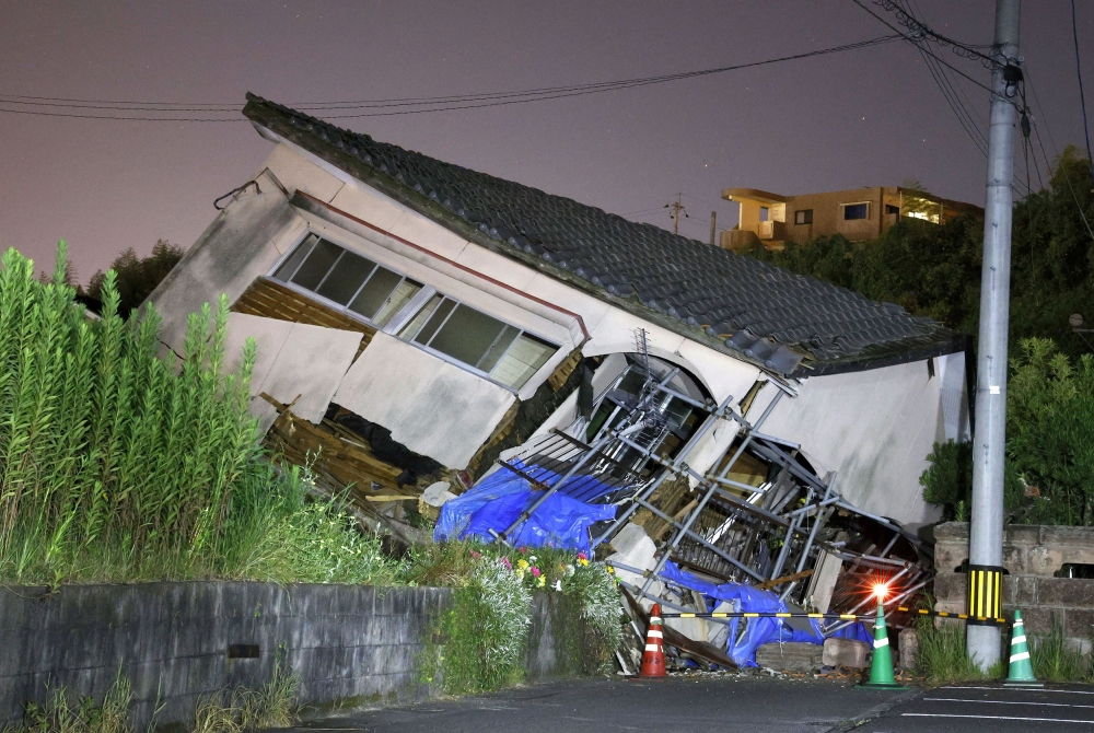 A huge earthquake was more likely in the aftermath of a magnitude 7.1 jolt in the south yesterday, which left 14 people injured. — Reuters pic/Kyodo