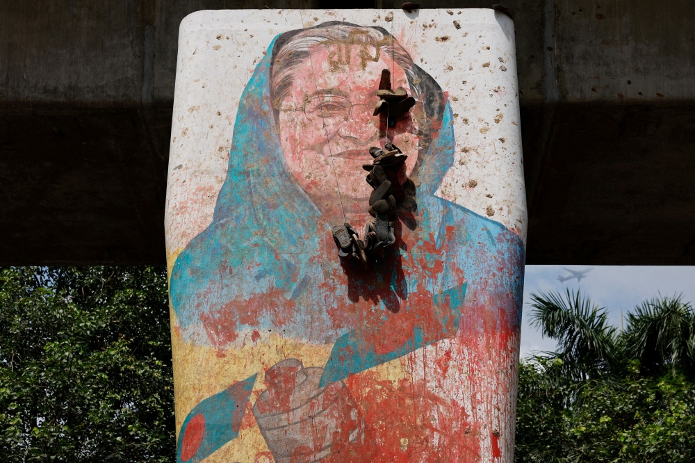 A mural of Bangladeshi Prime Minister Sheikh Hasina vandalised by protesters.  — Reuters pic