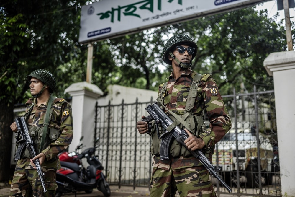 Bangladeshi military personnel stand guard at an empty police station in Dhaka on August 9, 2024. — AFP pic