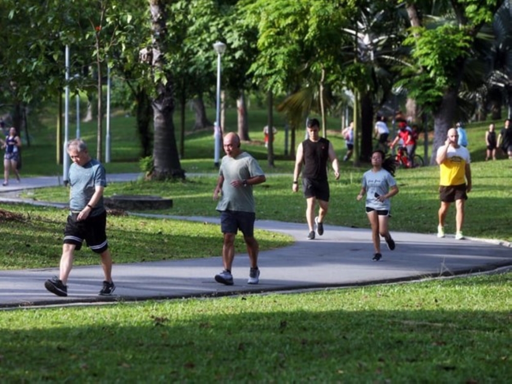 People exercising at Bishan-Ang Mo Kio Park. — TODAY pic