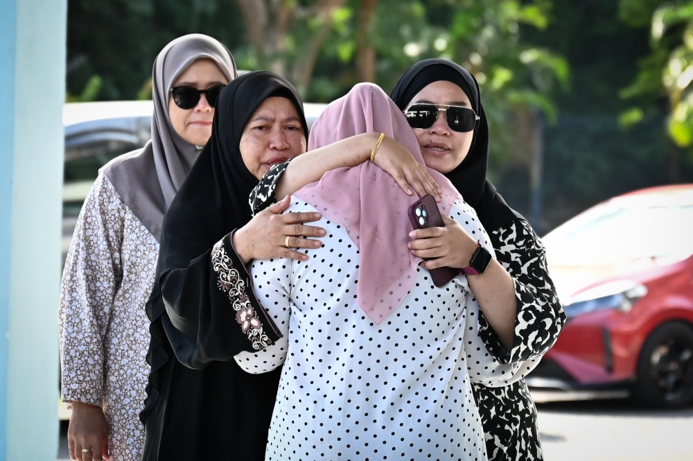 Family members of the victims wait at the Forward Search and Rescue Base at the Kemaman Maritime Zone of the Malaysian Maritime Enforcement Agency (MMEA) in Chukai, August 12, 2024. — Bernama pic 