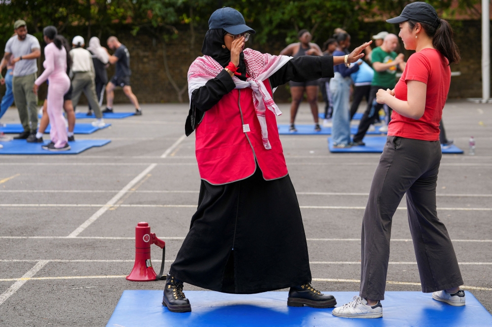 People take part in self defence classes lead by Stewart McGill, in London, Britain, August 10, 2024. — Reuters pic