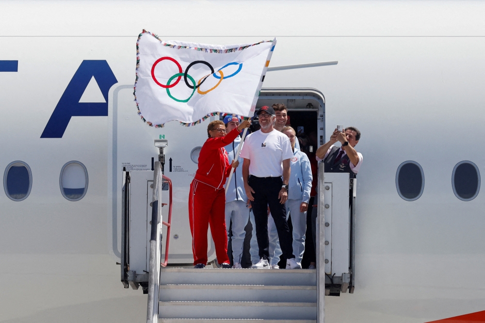 Los Angeles Mayor Karen Bass and LA28 Chairman Casey Wasserman return the official Olympic flag to Los Angeles for the first time in 40 years ahead of the 2028 Games, in Los Angeles, California. — Reuters pic