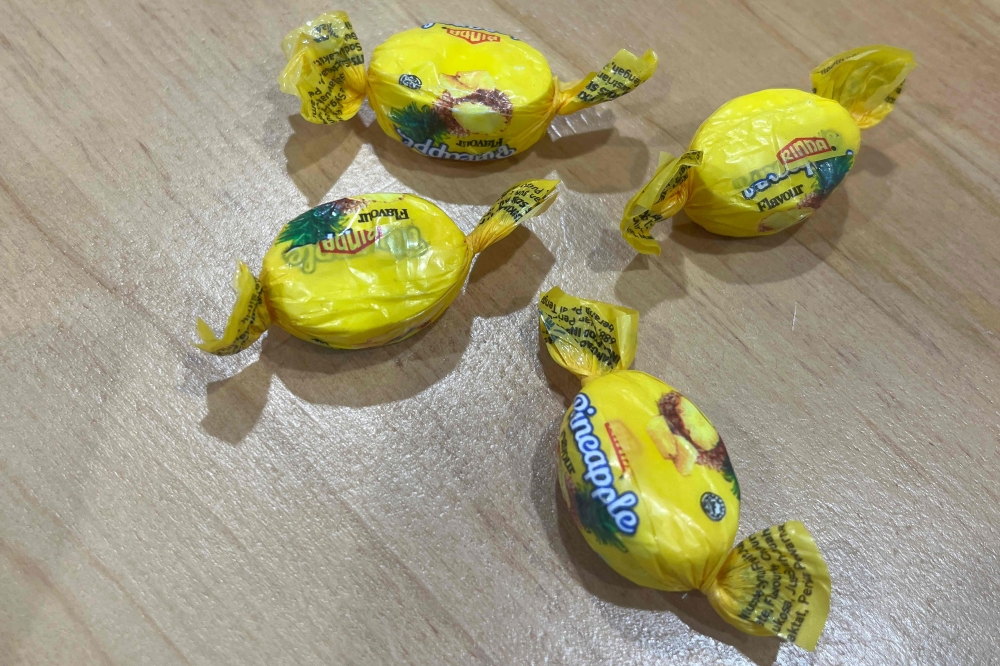 This handout taken on August 13, 2024 and released on August 14 by the New Zealand Police shows pineapple sweets laced with potentially lethal amounts of methamphetamine, in Auckland. Food parcels dished out by a New Zealand charity unknowingly contained a batch of the sweets was contaminated with the highly addictive illegal drug, police said. — New Zealand Police handout pic via Reuters 