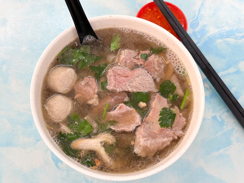 Against that blue cloud like background, my bowl of beef noodles at Old Kasturi Kopitiam felt heavenly with its distinct beefy broth and those tender pieces of beef brisket. — Picture by Lee Khang Yi