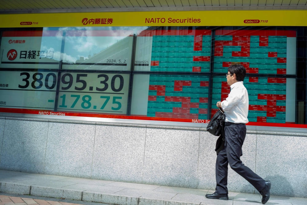 Asian markets surge as US inflation data raises rate optimism | Malay Mail