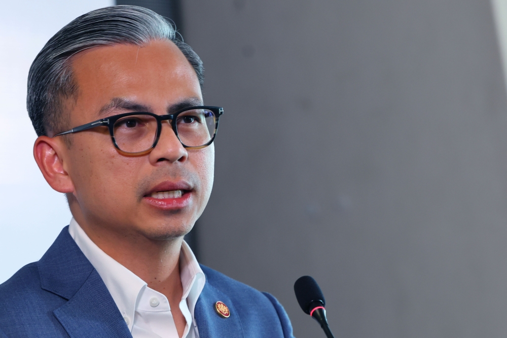 Fahmi Fadzil had filed separate suits against the three defendants on September 5 last year over an allegation that he gave a political speech at a mosque in Rawang, Selangor. — Bernama pic