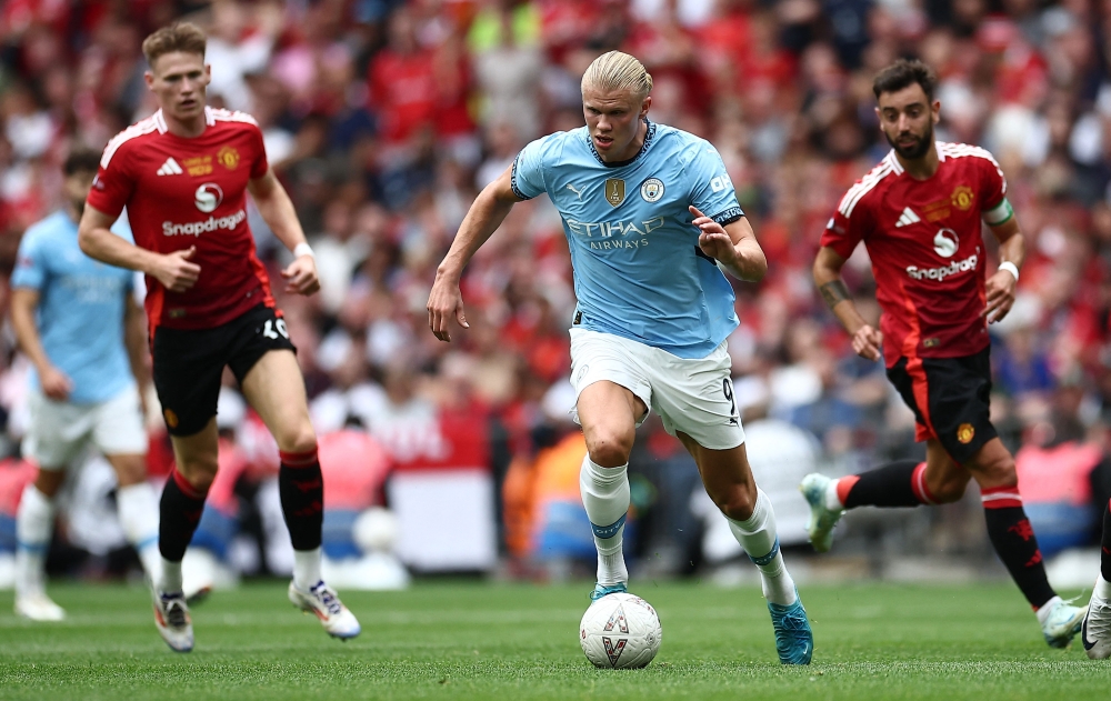 Manchester City's Norwegian striker Erling Haaland runs with the ball during the English FA Community Shield football match between Manchester City and Manchester United at Wembley Stadium, in London on August 10, 2024. — AFP pic